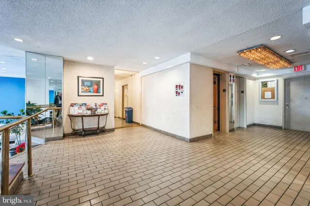 a view of a livingroom with workspace and a couch