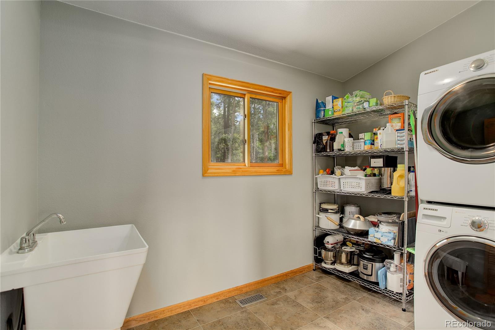 8360 South Warhawk Road Conifer, CO 80433 - Photo 25 of 40 a utility room with dryer and washer