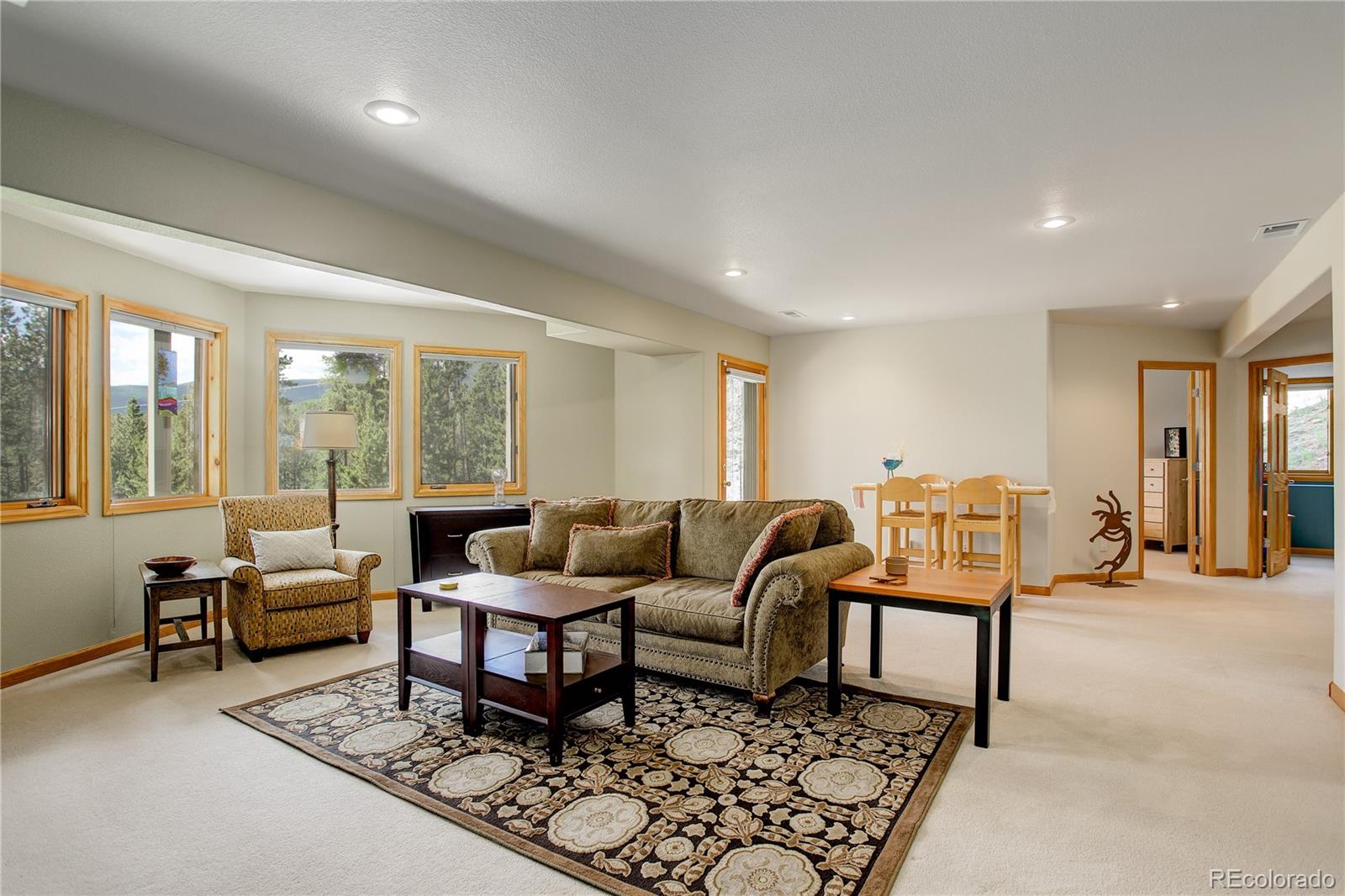 8360 South Warhawk Road Conifer, CO 80433 - Photo 27 of 40 a living room with furniture and a large window