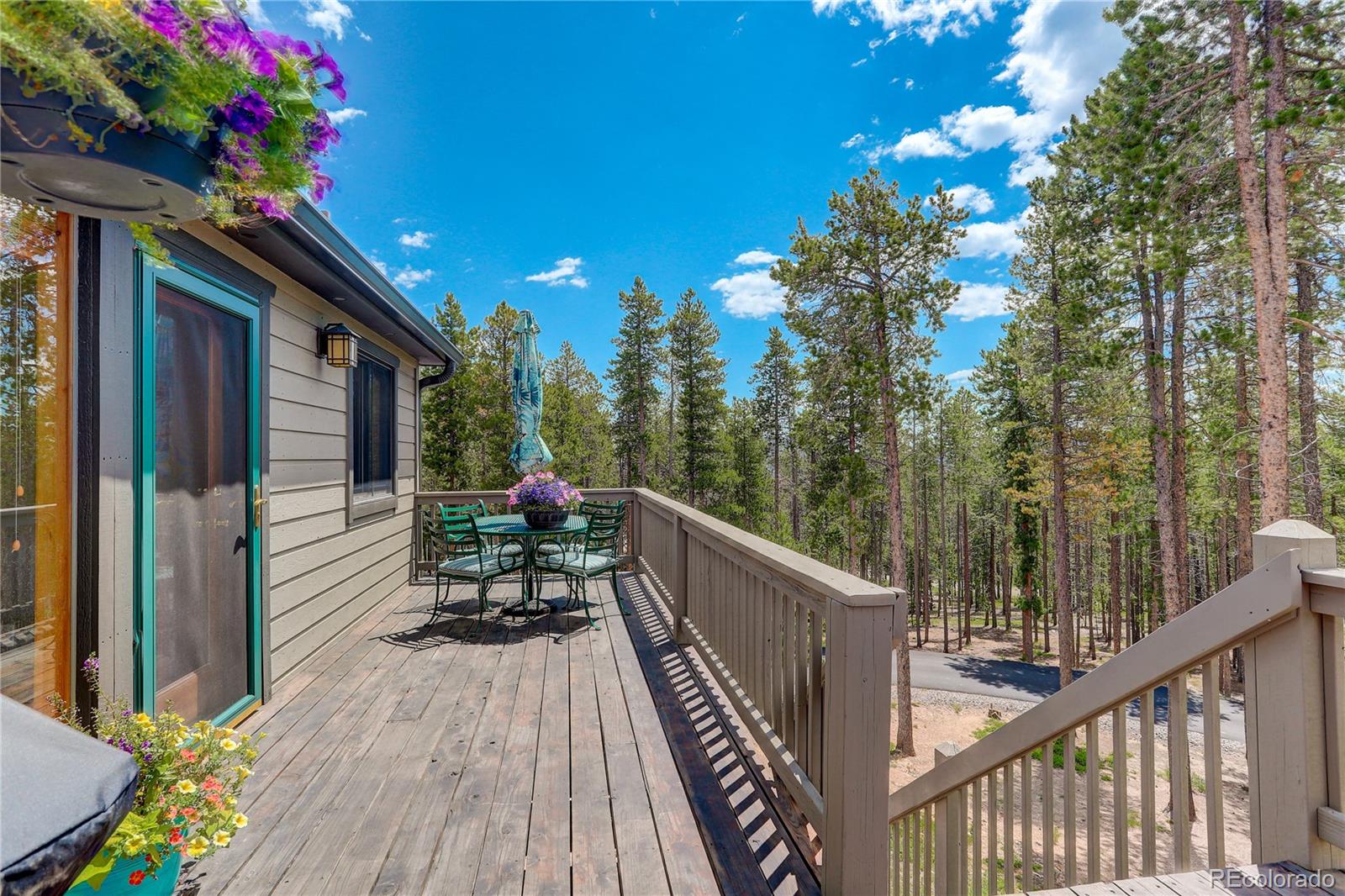 8360 South Warhawk Road Conifer, CO 80433 - Photo 6 of 40 a view of a balcony with chairs