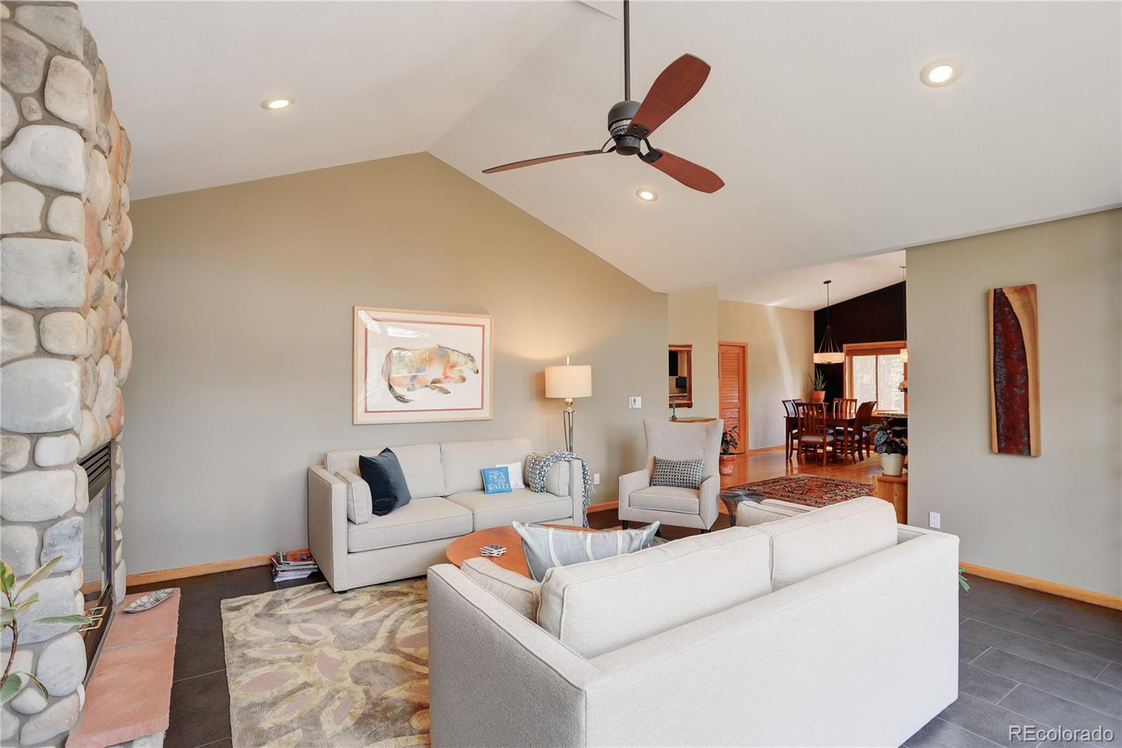 8360 South Warhawk Road Conifer, CO 80433 - Photo 10 of 40 a living room with furniture