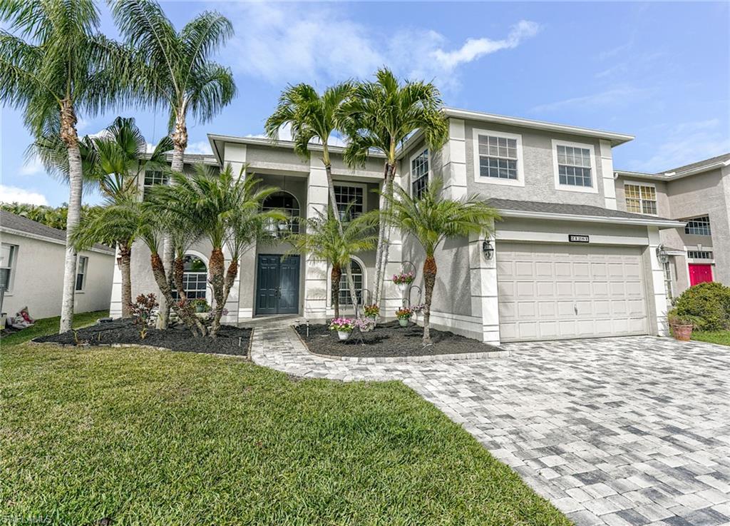 21281 Braxfield Loop Estero, FL 33928 - Photo 1 of 42 a front view of house with yard and green space