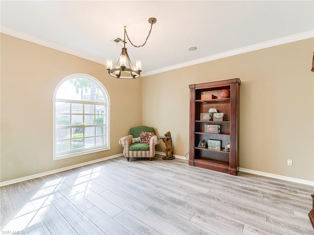 21281 Braxfield Loop Estero, FL 33928 - Photo 16 of 42 a living room with furniture and a large window