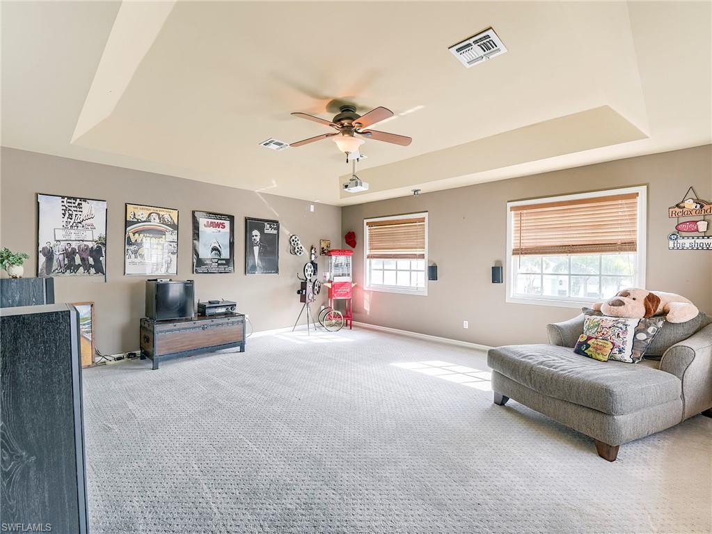21281 Braxfield Loop Estero, FL 33928 - Photo 23 of 42 a living room with furniture and a large window