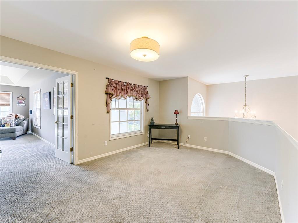21281 Braxfield Loop Estero, FL 33928 - Photo 25 of 42 a view of an empty room with a window