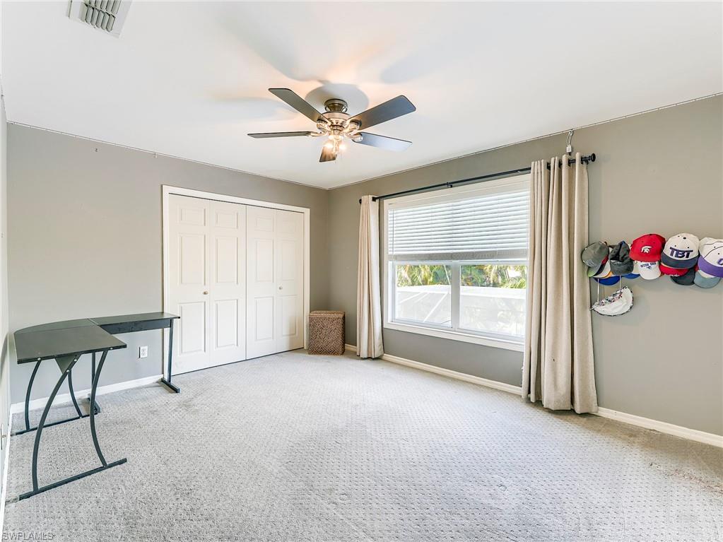 21281 Braxfield Loop Estero, FL 33928 - Photo 28 of 42 a view of a livingroom with a ceiling fan and window