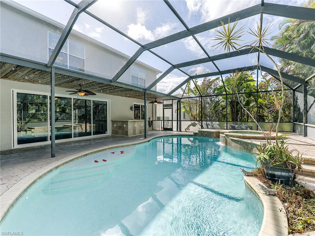 21281 Braxfield Loop Estero, FL 33928 - Photo 36 of 42 a view of a swimming pool with a patio