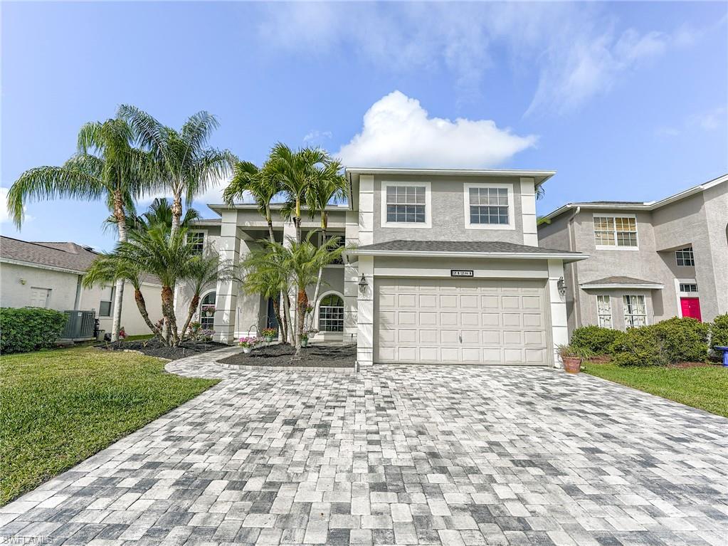 21281 Braxfield Loop Estero, FL 33928 - Photo 37 of 42 a front view of a house with a garden