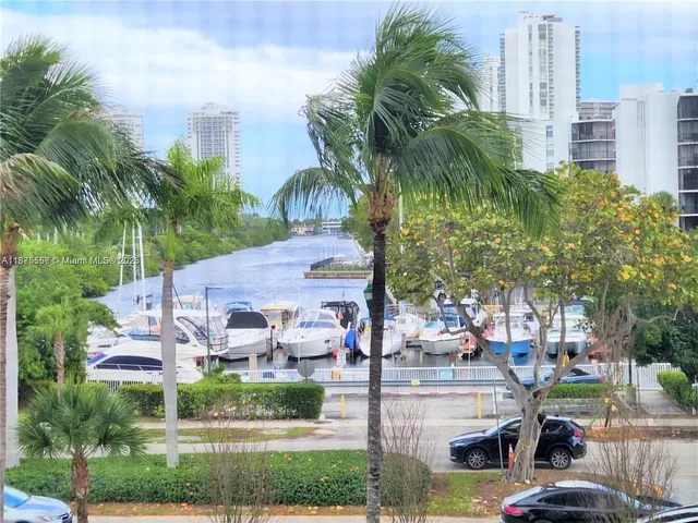 a view of multiple houses with yard