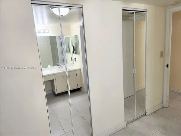 a bathroom with a mirror and a sink
