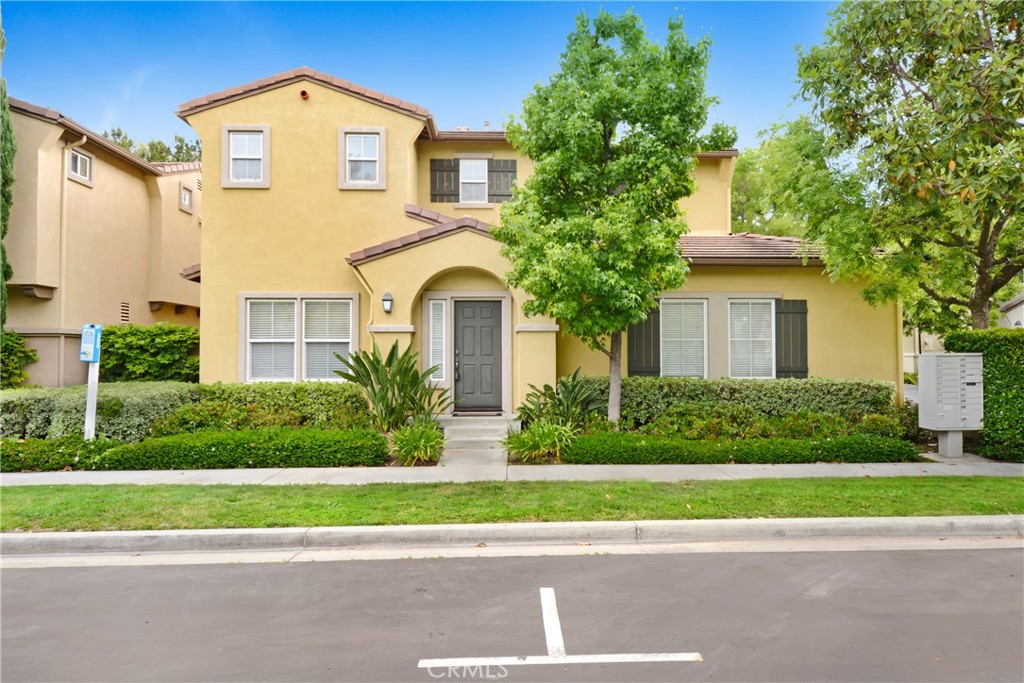 5 Chinaberry Irvine, CA 92618 - Photo 1 of 1 a front view of a house with a yard and garage