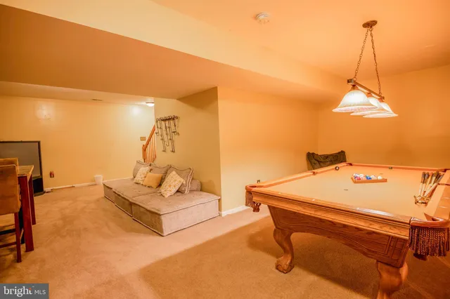 a bedroom with a bed and flat screen tv