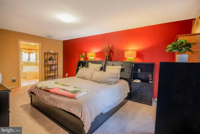 a bed room with a bed and a window