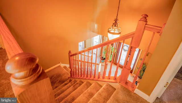 a dining room with furniture and a window