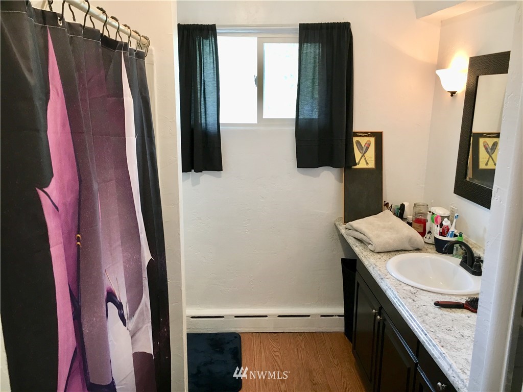 428 North Laventure Road Mount Vernon, WA 98273 - Photo 12 of 24 a bathroom with a sink vanity and a mirror