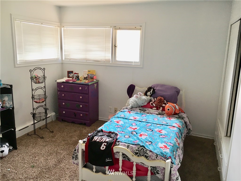 428 North Laventure Road Mount Vernon, WA 98273 - Photo 13 of 24 a bedroom with a bed and a dresser
