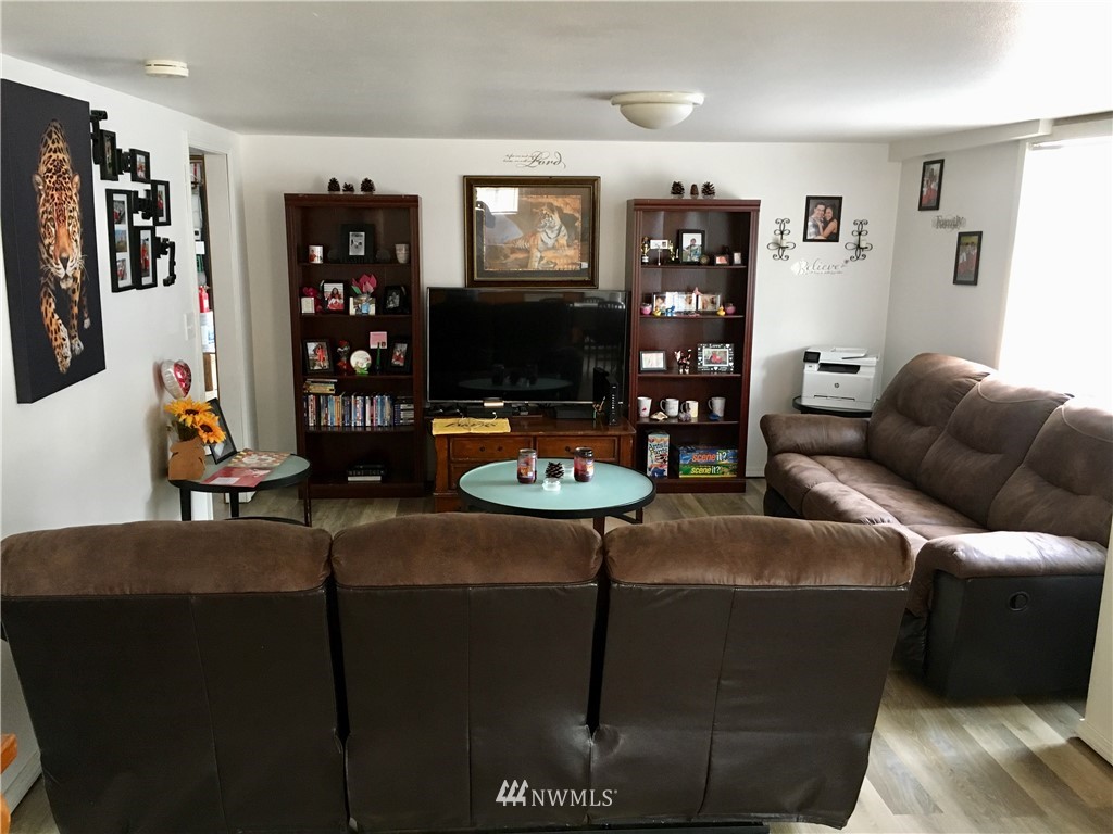 428 North Laventure Road Mount Vernon, WA 98273 - Photo 17 of 24 a living room with furniture and floor to ceiling window