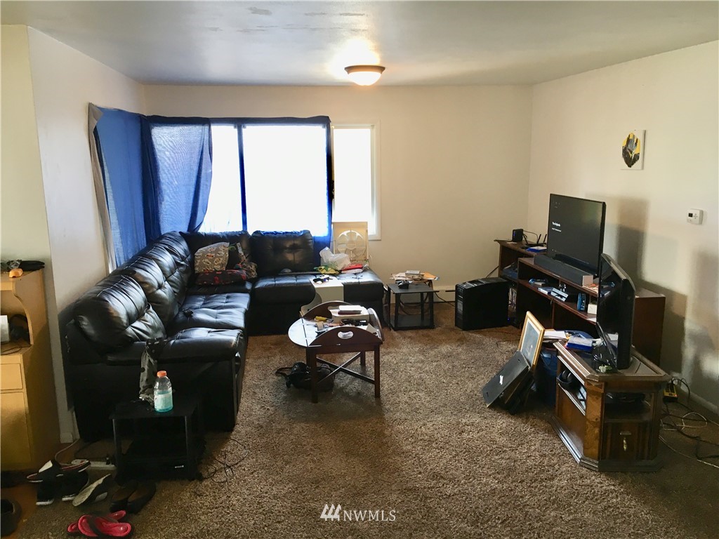 428 North Laventure Road Mount Vernon, WA 98273 - Photo 7 of 24 a living room with furniture and a flat screen tv