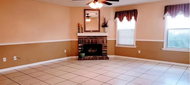 a view of livingroom with furniture and window