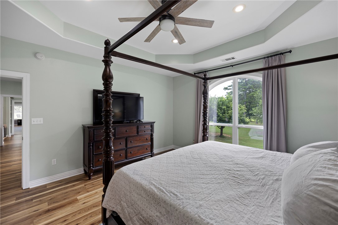 751 Walthall Road Russellville, AR 72802 - Photo 16 of 60 Bedroom featuring a tray ceiling, recessed lighting, and a ceiling fan