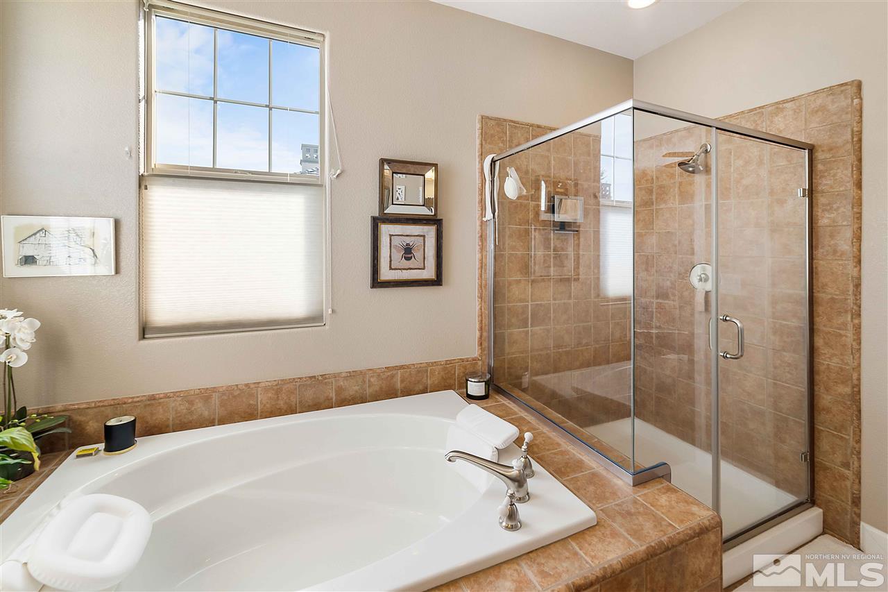 1680 Sawtooth Trail Reno, NV 89523 - Photo 17 of 24 a bathroom with a tub and a shower