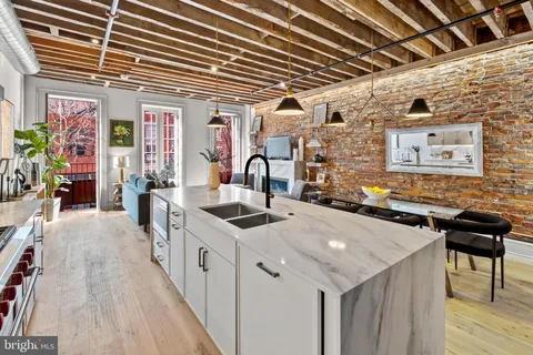 a kitchen that has a lot of cabinets in it