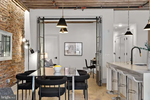 a dining room with furniture and window
