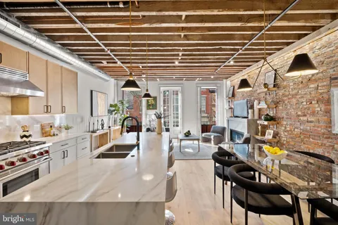 a large white kitchen with lots of counter top space