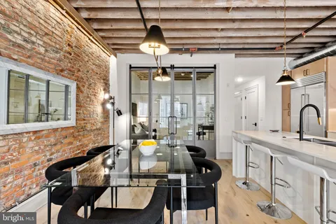 a kitchen with a sink appliances and cabinets