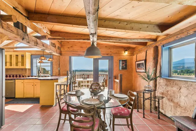 a outdoor space with lots of furniture and a fireplace