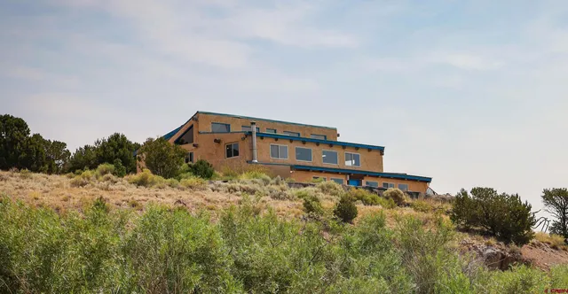 a house view with a backyard space