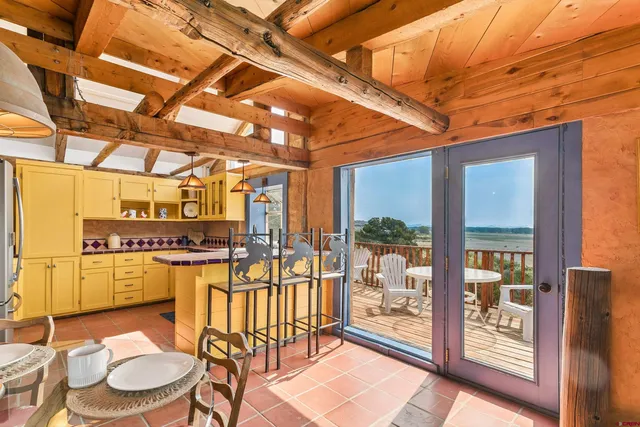 a kitchen with a stove a sink and cabinets