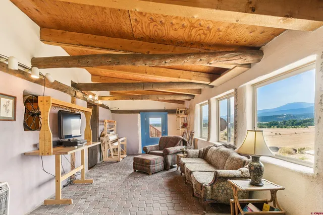 a view of a livingroom with furniture and a couch