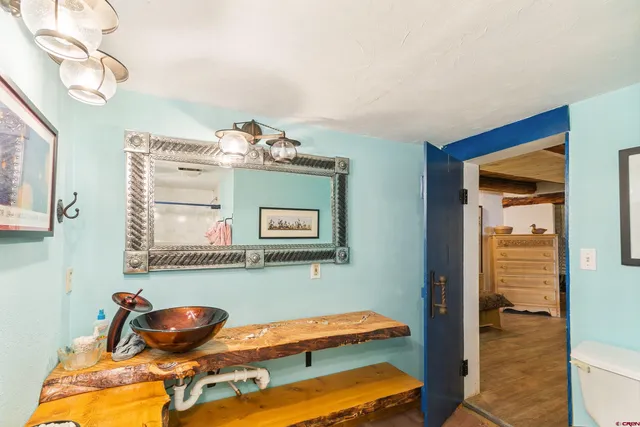 a view of a balcony with wooden floor and outdoor space