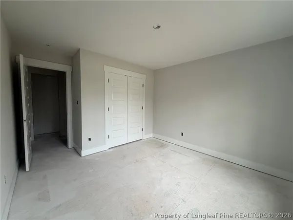 a view of a room with air conditioner and a window