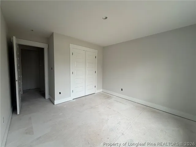 a view of a room with air conditioner and a window