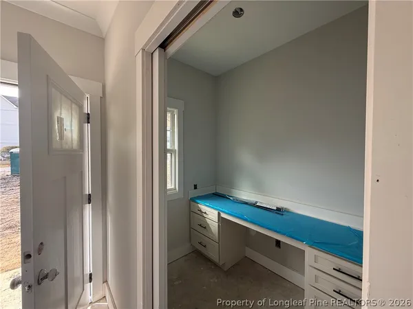 a room with pool table and a window