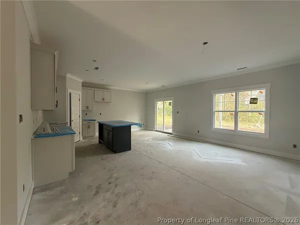 a view of a big room with windows and cabinet