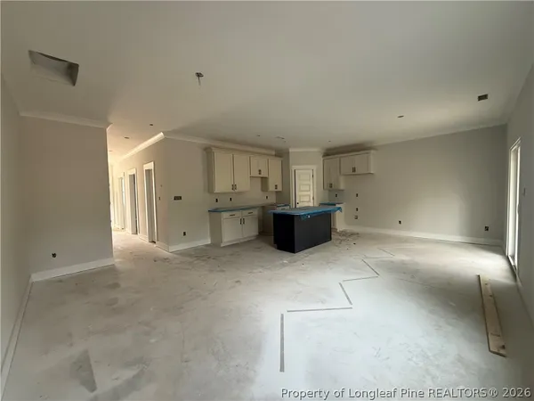 a kitchen with stainless steel appliances granite countertop a sink stove and white cabinets