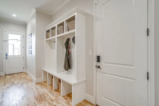 a view of walk in closet with white walls