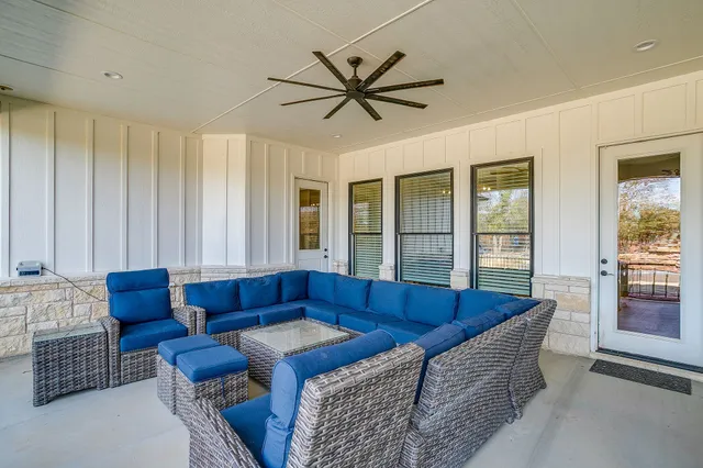a living room with furniture and a window