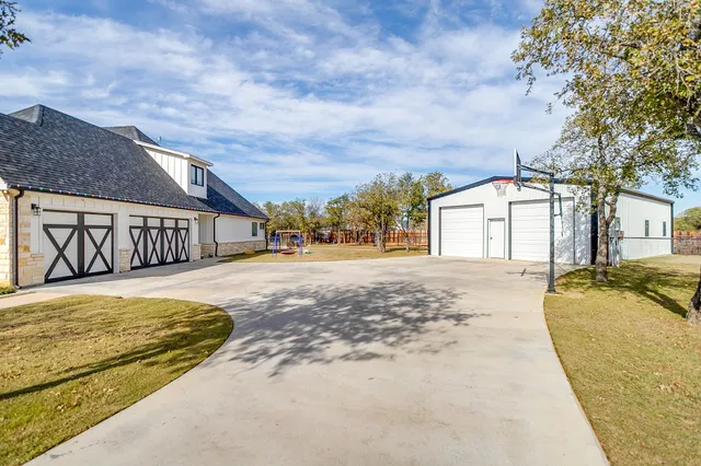 a view of large house with a yard