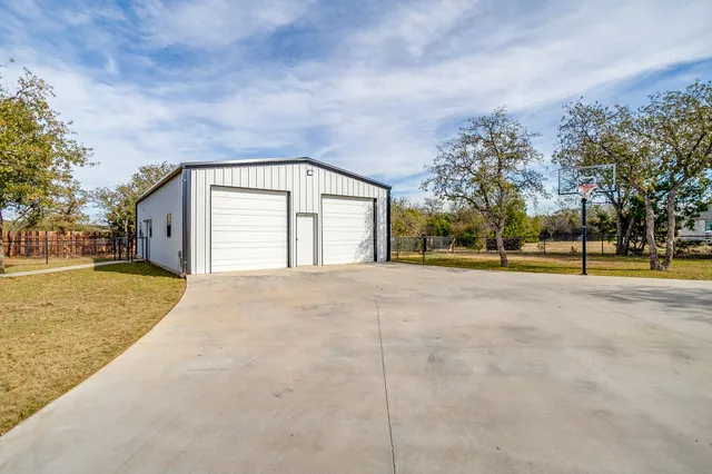 a view of a swimming pool with a patio