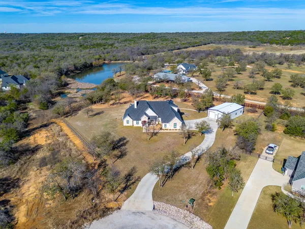 an aerial view of residential houses with outdoor space