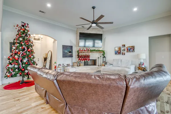 a bed room with a bed mirror and a ceiling fan