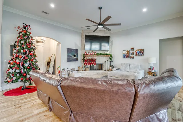 a bed room with a bed mirror and a ceiling fan