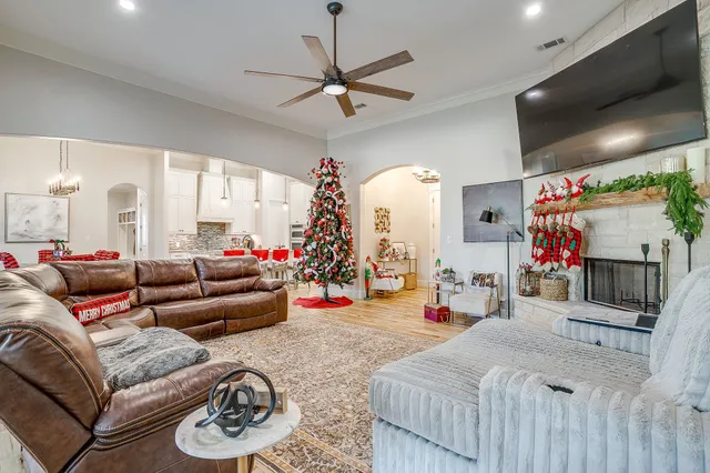 a bed room with furniture and a flat screen tv