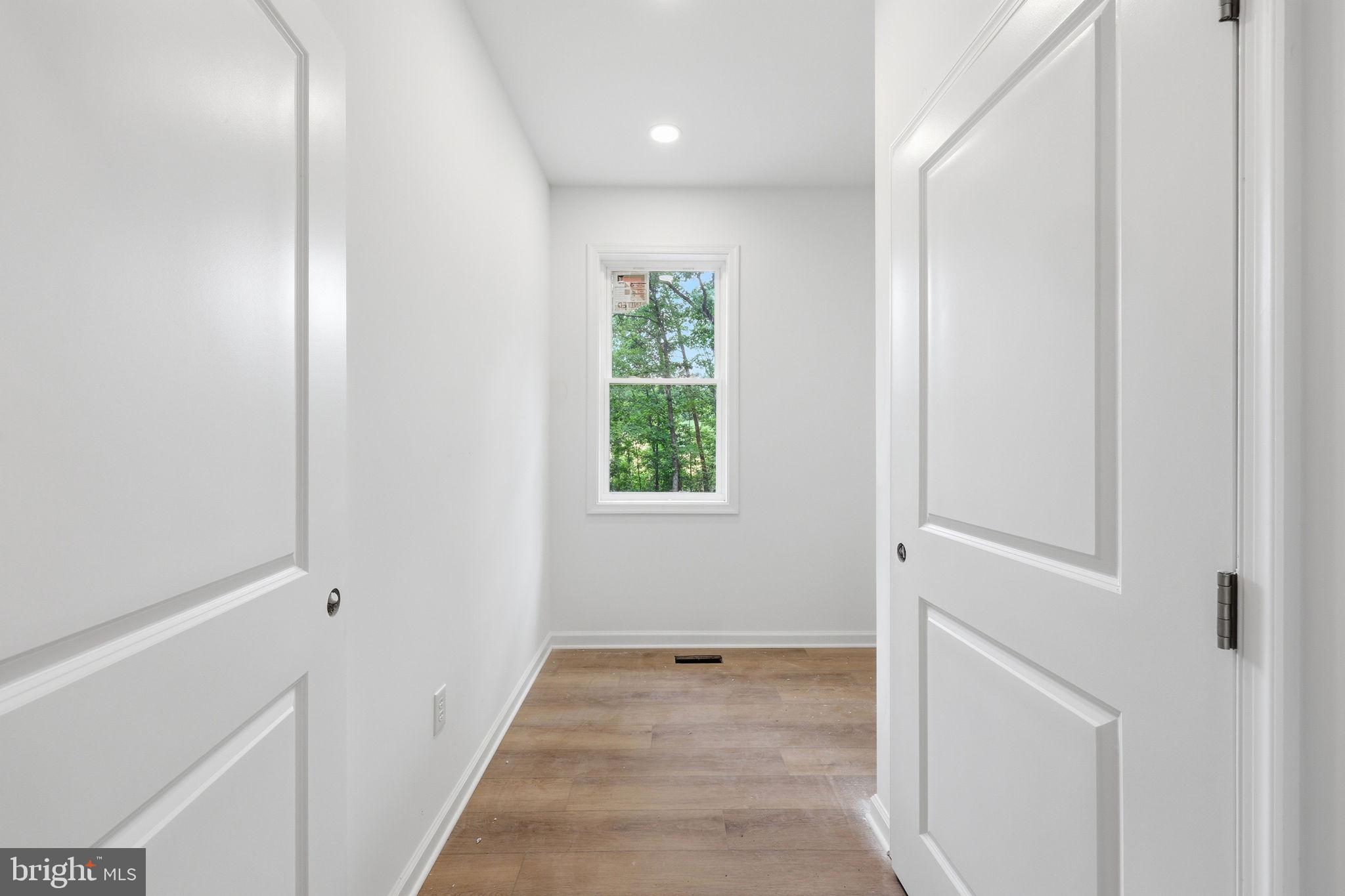 10339 Back Creek Valley Road Hedgesville, WV 25427 - Photo 19 of 48 a view of a hallway with window