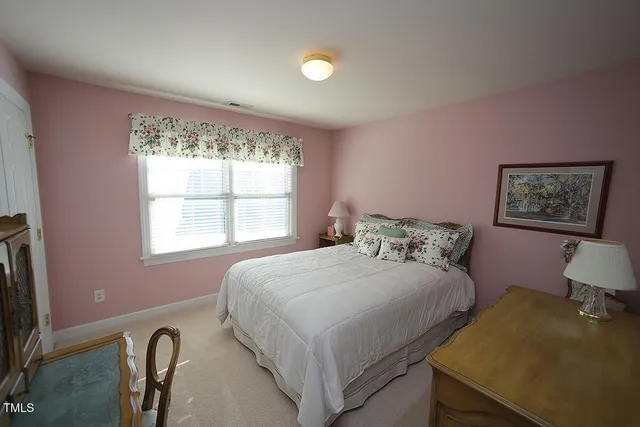 a view of a workspace with furniture and a bookshelf