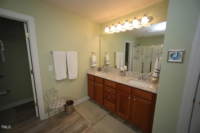 a spacious bedroom with a bed and a window